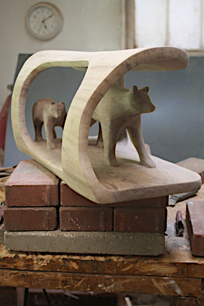 Frontal view of bear carving.