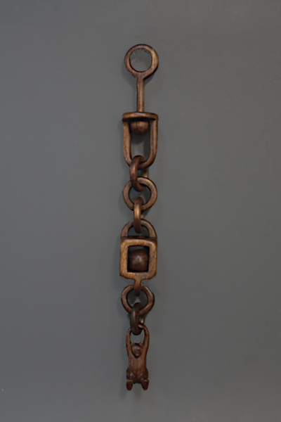 Complete wooden chain with 
		oil finish applied.