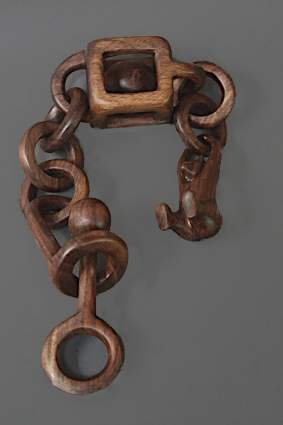 Completed 
		wooden chain with oil finish applied.